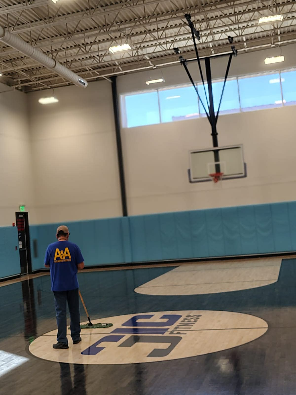 A&A Cleaning Services Texas team member cleaning a commercial gym floor